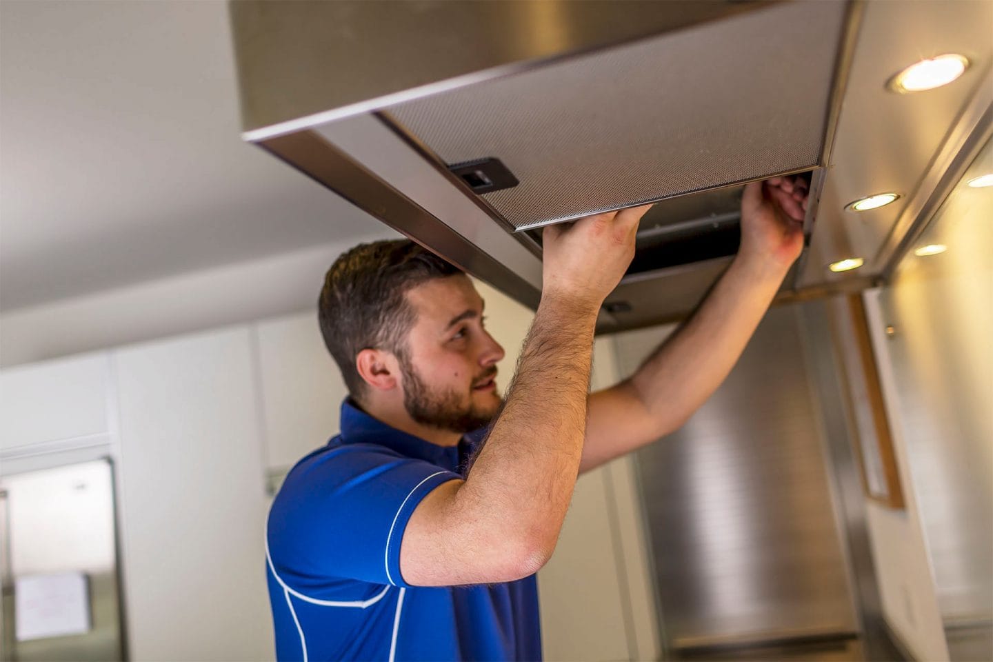 Kitchen hood installer fitting commercial canopy in Aldershot